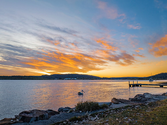 High cloud sunrise at the waterfront