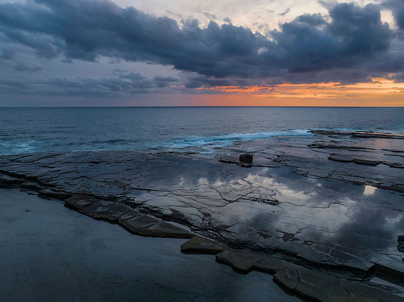 Sunrise over the sea and rocky Inlet