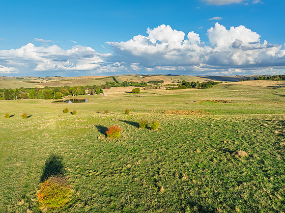 Golden hour light over the rural landscape with clouds