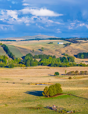 Golden hour light over the rural landscape with clouds