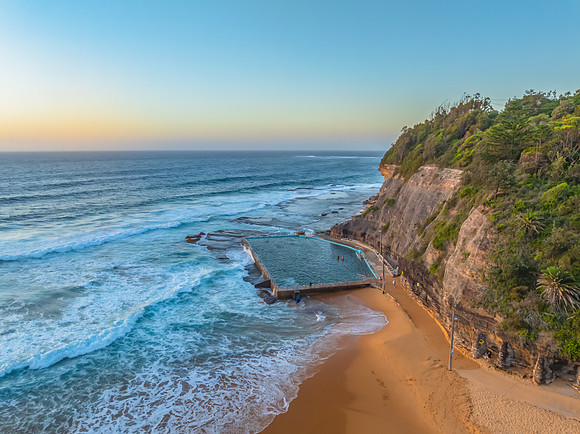 Sunrise at the Seaside with a hazy cloudless sky