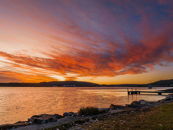 High cloud sunrise at the waterfront
