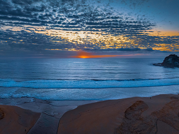 Beautiful sunrise with clouds over the ocean