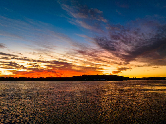 High cloud sunrise at the waterfront