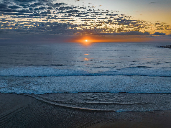Beautiful sunrise with clouds over the ocean