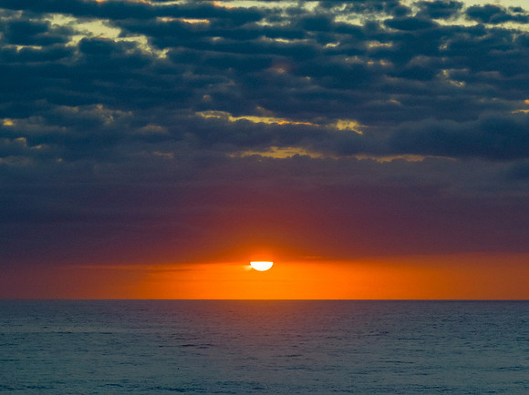 Beautiful sunrise with clouds over the ocean