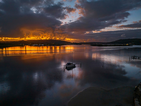Dawn over the bay with clouds and orange highlights