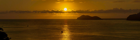 Sunrise views over the bay with boats and mountain ranges from P