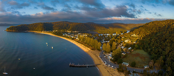Sunrise views over the bay with boats and mountain ranges from P