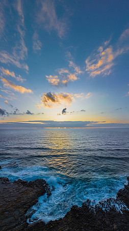 Sunrise over the ocean and rock platform