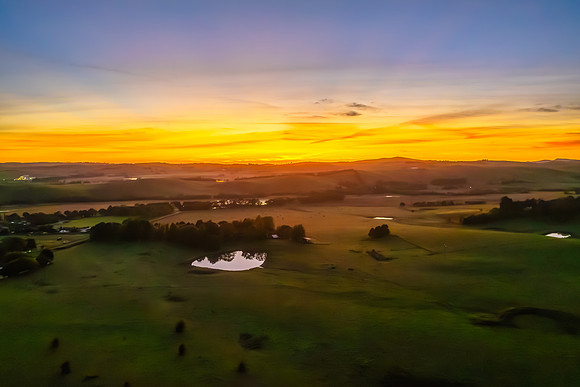 High-Cloud Dawn Over Rural Landscape
