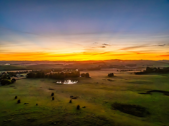 High-Cloud Dawn Over Rural Landscape