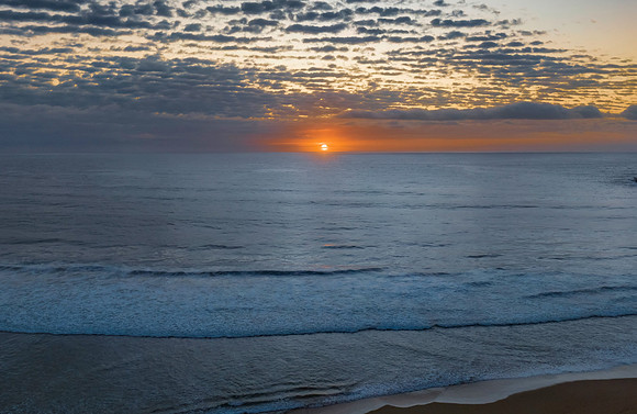Beautiful sunrise with clouds over the ocean