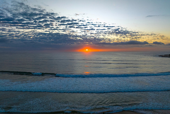 Beautiful sunrise with clouds over the ocean