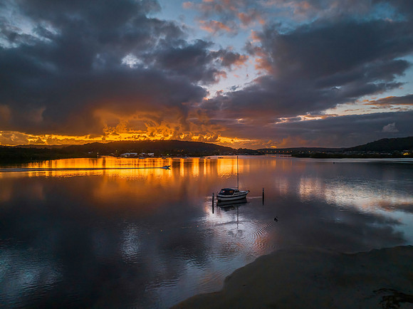 Dawn over the bay with clouds and orange highlights
