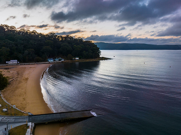 Sunrise views over the bay with boats and mountain ranges from P