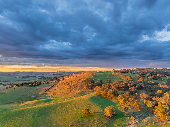 Sunrise and rain clouds over the countryside