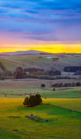 Sunrise and rain clouds over the countryside