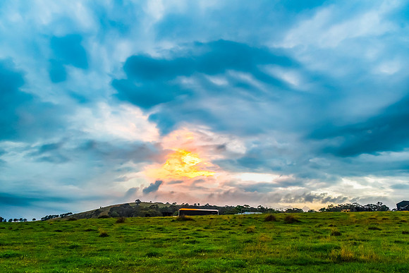 Sunset and stormy skies over the rural countryside