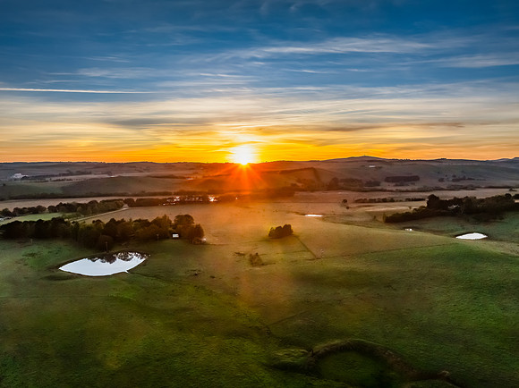 High-Cloud Sunrise Over Rural Landscapes on the Edge of a Countr