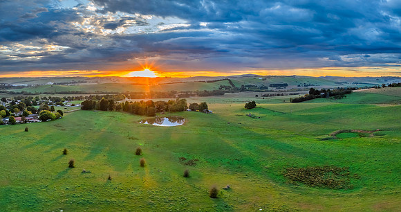 Sunrise and rain clouds over the countryside