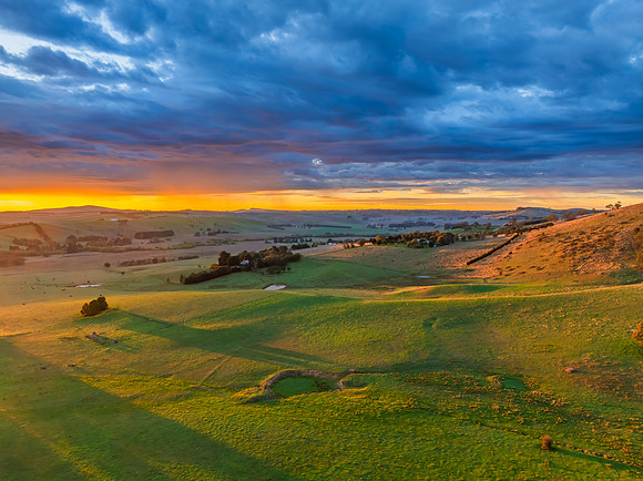 Sunrise and rain clouds over the countryside
