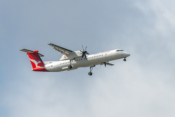 VH-84B Bombardier DHC-8-402 Aircraft in the grey afternoon sky
