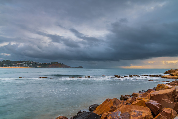 Rain clouds and storm light sunrise seascape