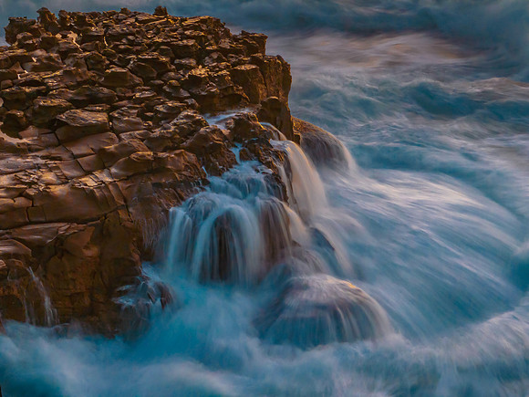 Dawn at the seaside with cascades over the rock platform