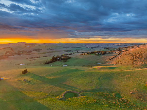 Sunrise and rain clouds over the countryside