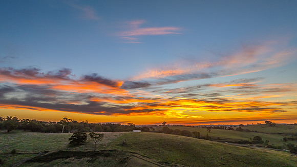 Soft Evening Light and High Cloud Over the Country Landscape