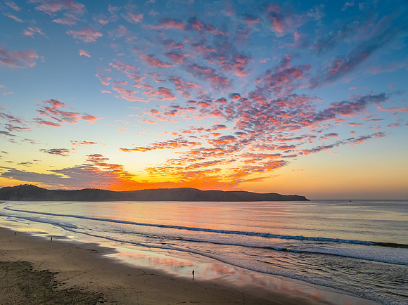 Sunrise seascape with pretty clouds in the sky