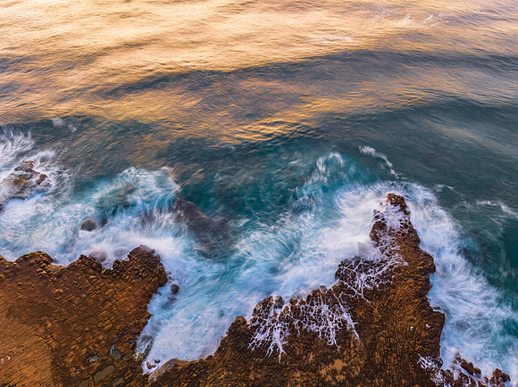 Top down view over tessellated rock platform at the seaside