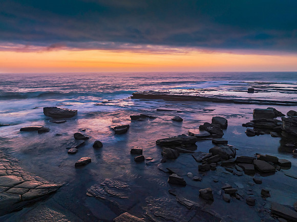 Hazy Summer Sunrise Seascape and Rocky Inlet