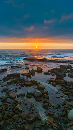 Hazy Summer Sunrise Seascape and Rocky Inlet