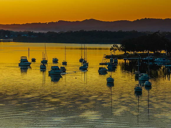 Golden hour on the bay with boats