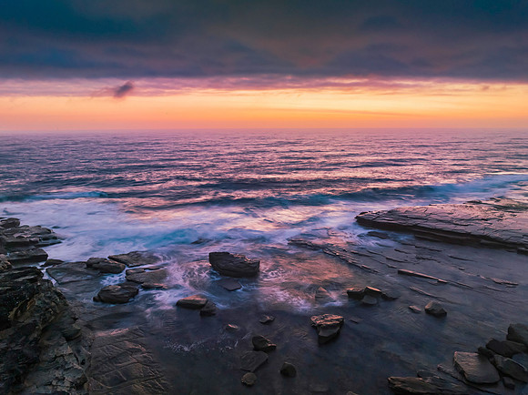 Hazy Summer Sunrise Seascape and Rocky Inlet