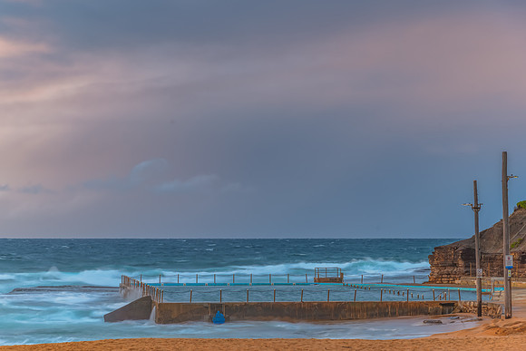 Seaside Sunrise with a hint of rain in the clouds