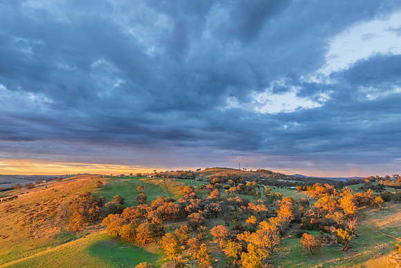 Sunrise and rain clouds over the countryside