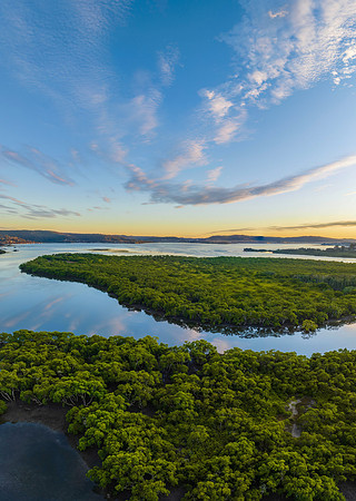 High cloud sunrise over the bay water
