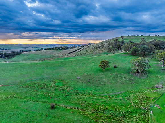 Sunrise and rain clouds over the countryside