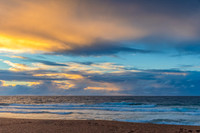 Seaside Sunrise with a hint of rain in the clouds