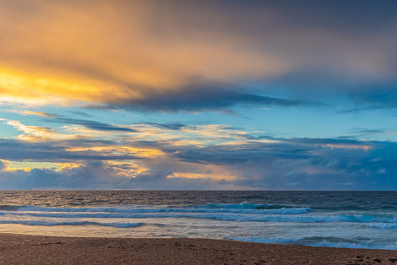 Seaside Sunrise with a hint of rain in the clouds