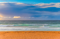 Seaside Sunrise with a hint of rain in the clouds