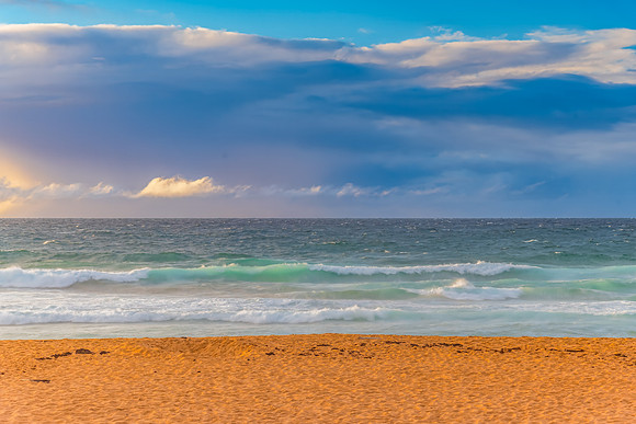 Seaside Sunrise with a hint of rain in the clouds