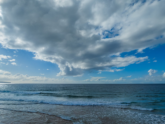 Morning views at the seaside with clouds and a blue sky