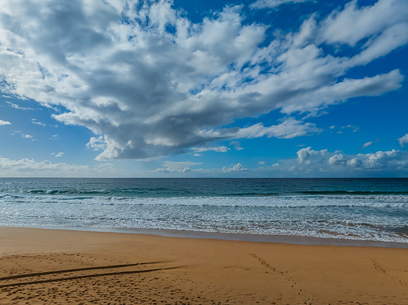 Morning views at the seaside with clouds and a blue sky