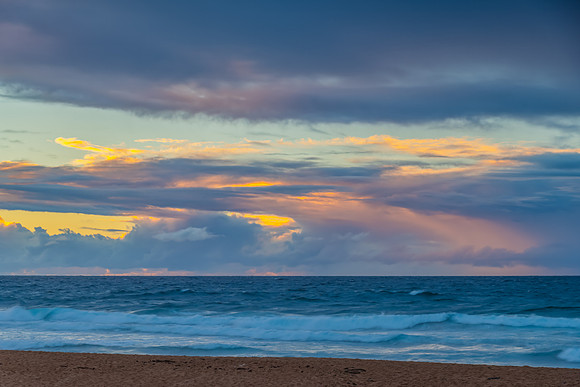 Seaside Sunrise with a hint of rain in the clouds