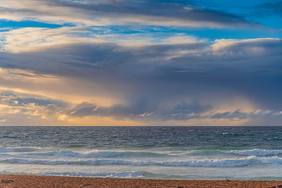 Seaside Sunrise with a hint of rain in the clouds