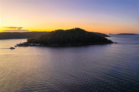 Aerial sunrise waterscape with boats and clear skies